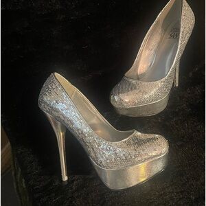Speed Limit 98 silver stilettos